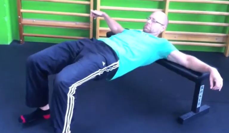 Image of a man performing a hip extension