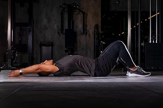 Image of a man stretching has back using the back pain relief stretcher