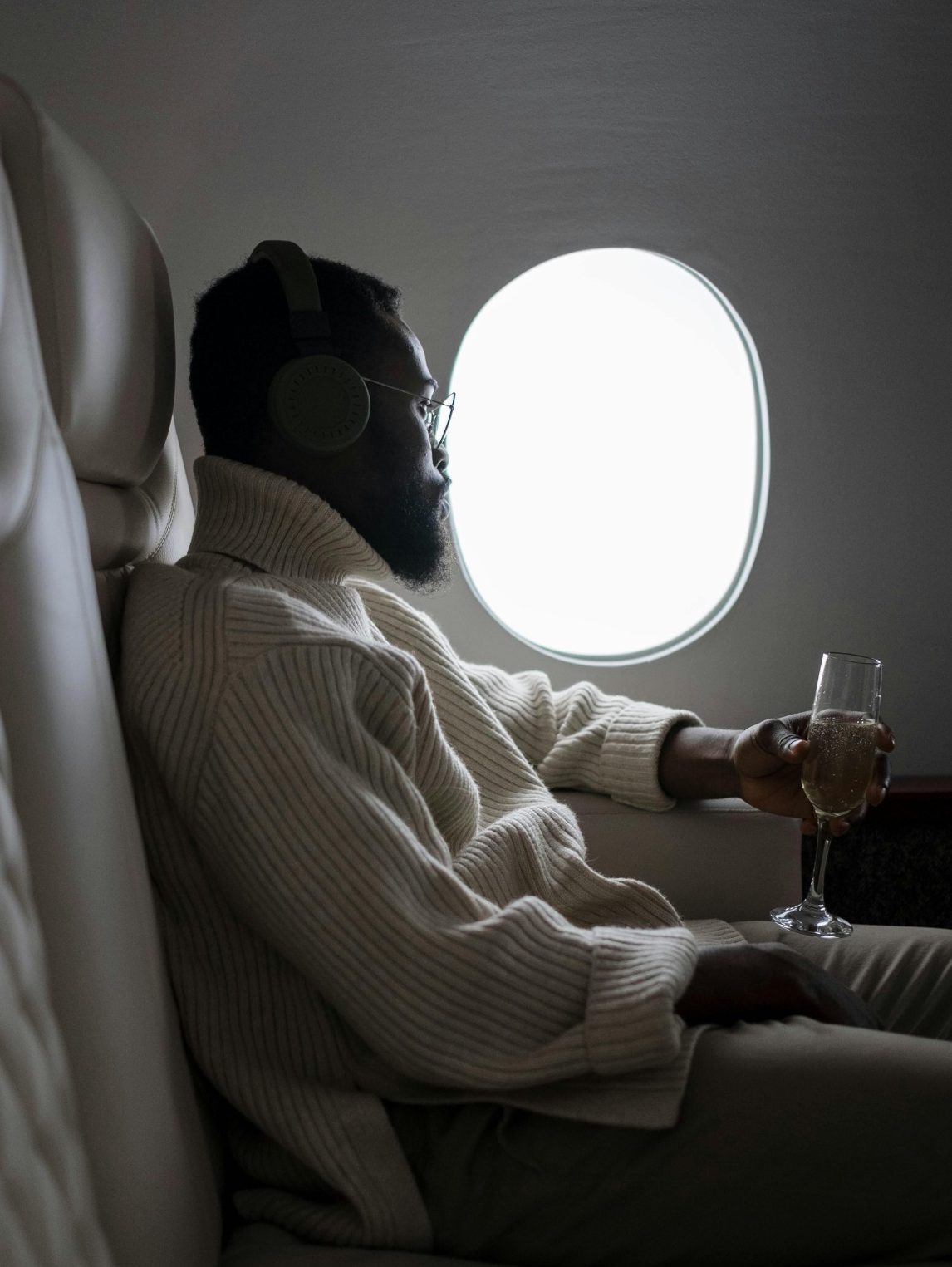 Image of a man sitting comfortably in an airplane