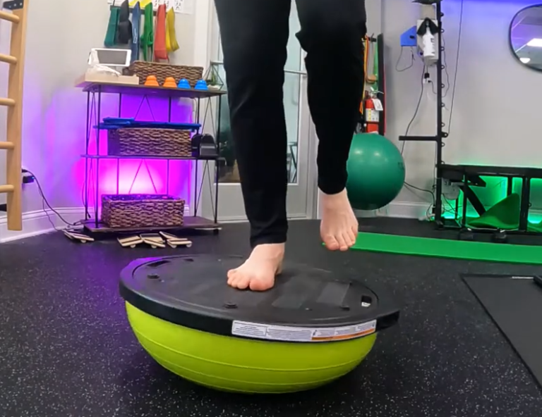 Image of a man's feet on a bosu ball